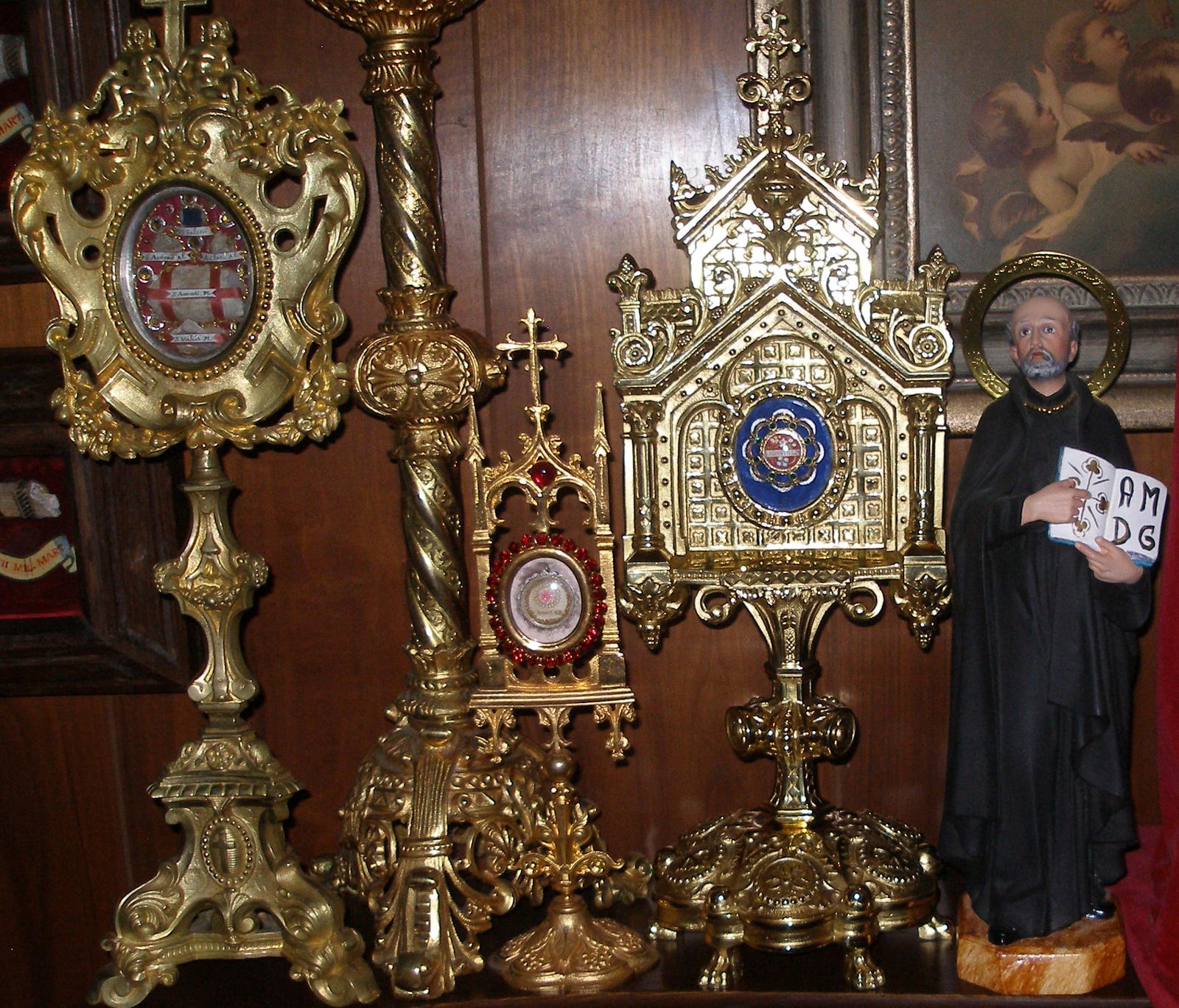 Spanish statue of St. Ignatius among gilt French reliquaries in the family oratory